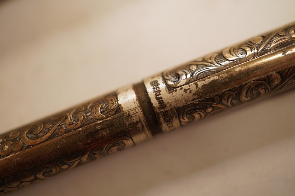 A Sheaffer 'White Spot' fountain pen with 14K gold nib and chevron decoration and three other pens